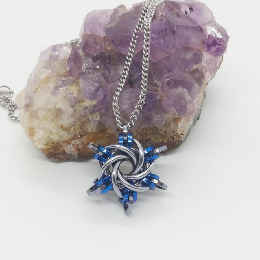 Starry Night pendant, made with anodized aluminum and stainless steel rings.