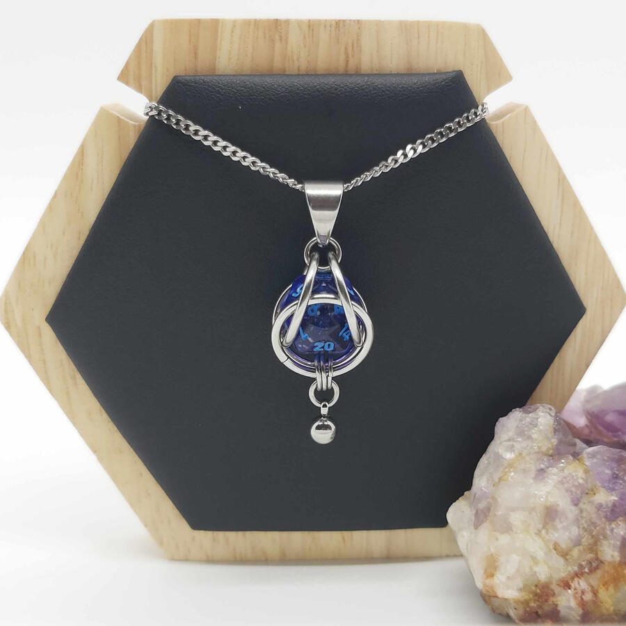 Captured D20 pendant, mini. Made with stainless steel and a mini 20 sided die.