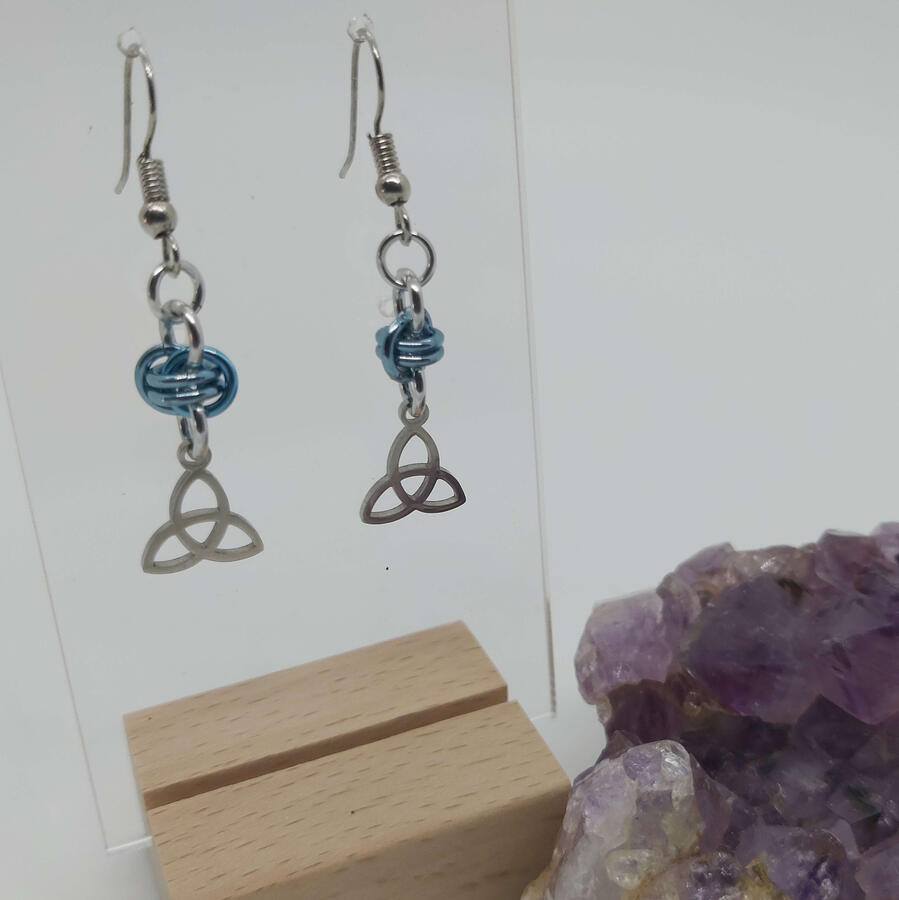 Fairy Knot Earrings, made with anodized aluminum rings and stainless steel charms.